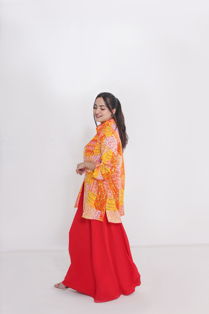 Red straight dress  paired with a vibrant  painted shirt