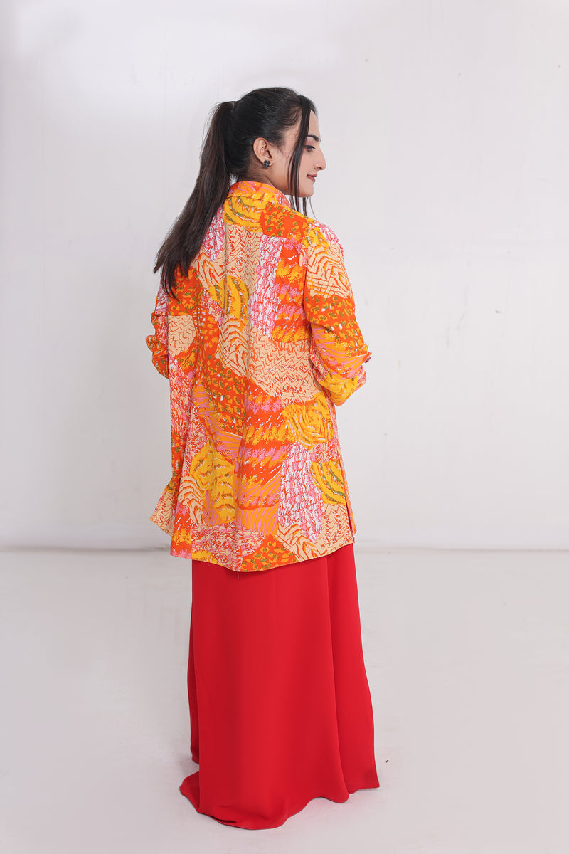 Red straight dress  paired with a vibrant  painted shirt